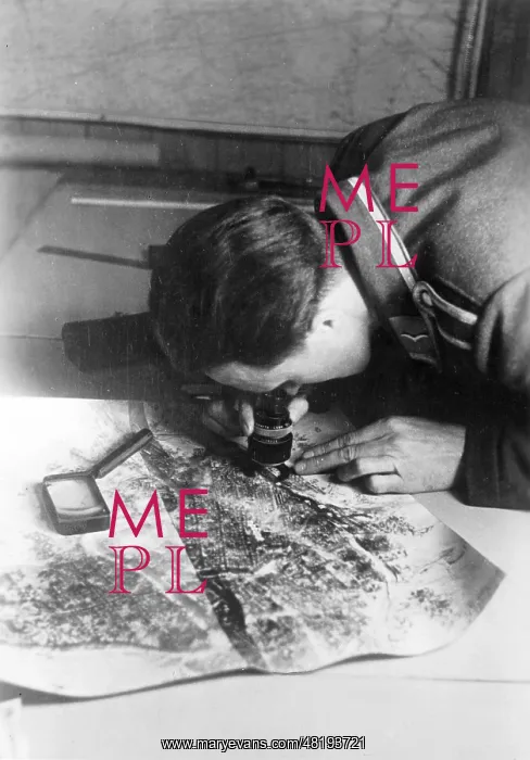 : German soldier analyses reconnaissance images, 1941 : German soldier analyses reconnaissance images, 1941