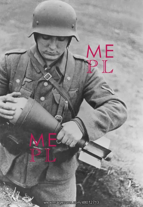 : German soldier with a bazooka shell, 1944 : German soldier with a bazooka shell, 1944