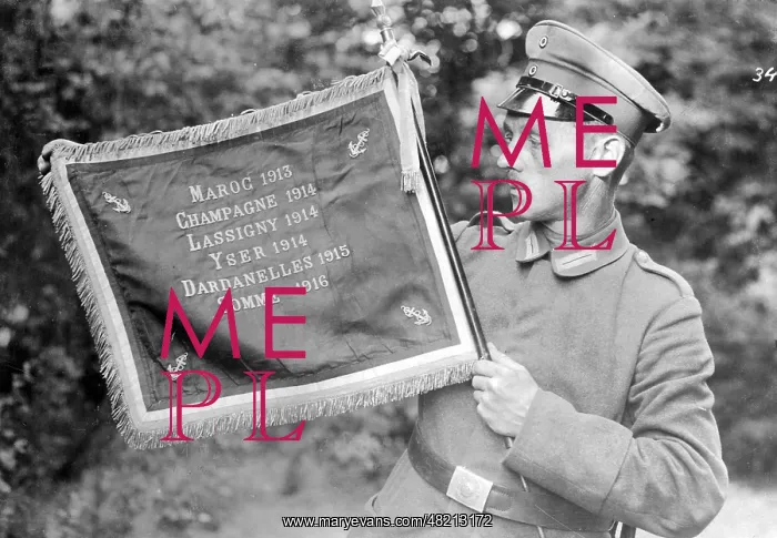 : German soldier with captured enemy flag, 1917 : German soldier with captured enemy flag, 1917