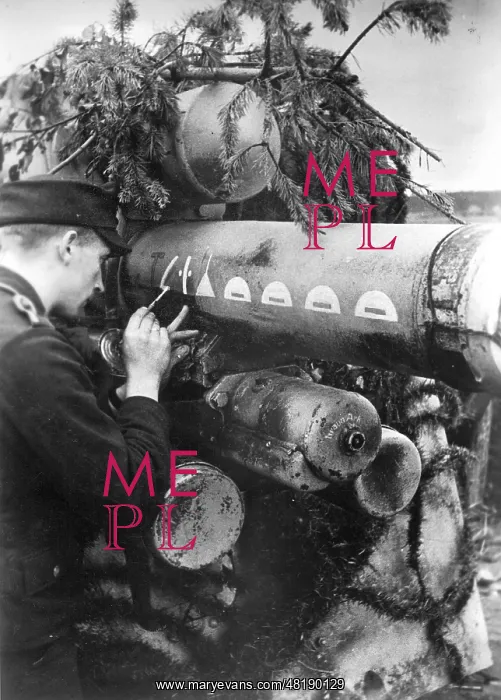 : German soldier marks successful hits on a Flak gun, 1944 : German soldier marks successful hits on a Flak gun, 1944
