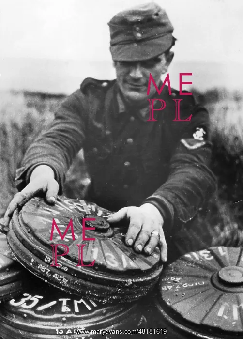 : German soldier with mines, 1944 : German soldier with mines, 1944