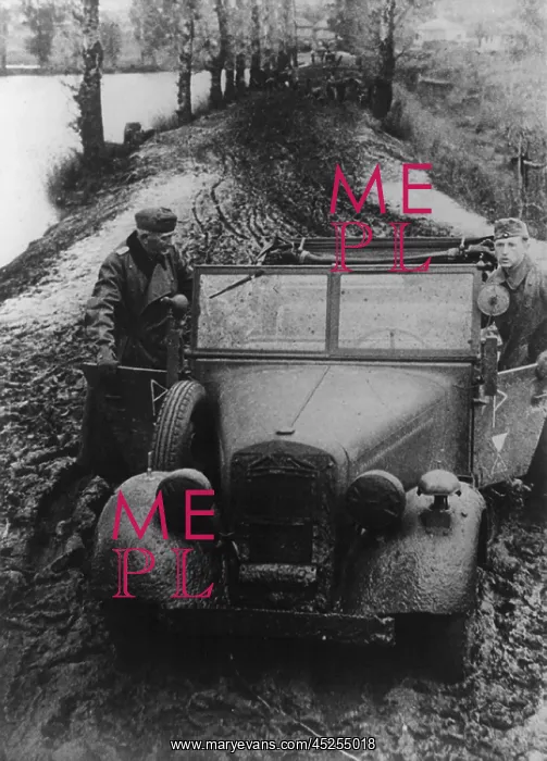 : German soldier and officer pushing their car through : German soldier and officer pushing their car through