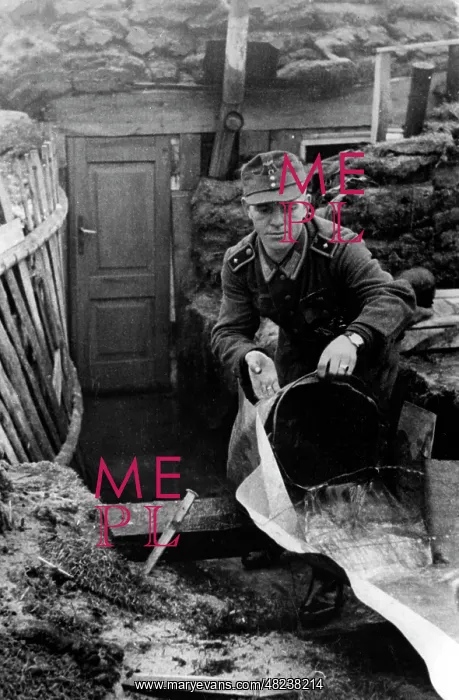 : German soldier in front of a shelter on the Eastern Front : German soldier in front of a shelter on the Eastern Front