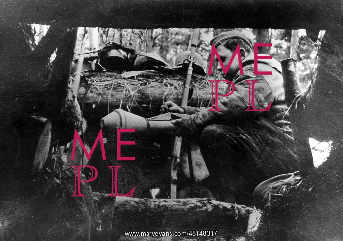 : German soldier in a shelter on the Oder, 1945 : German soldier in a shelter on the Oder, 1945