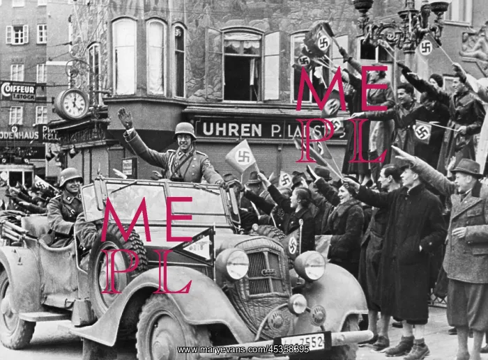 : German soldier waving to the Viennese crowd during : German soldier waving to the Viennese crowd during