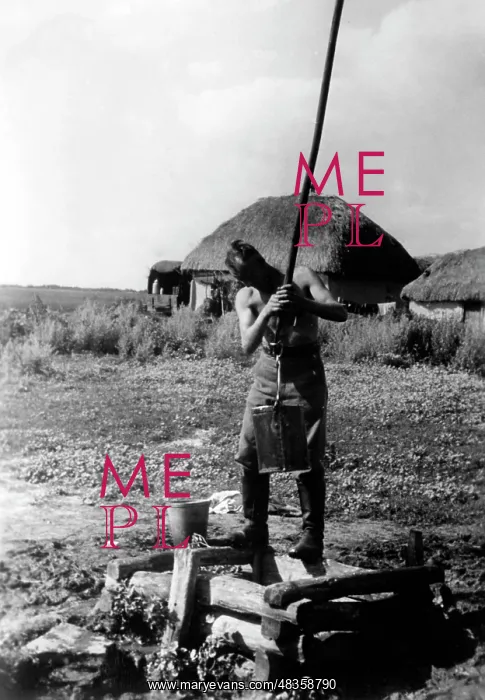 : German soldier at a well, 1942 : German soldier at a well, 1942