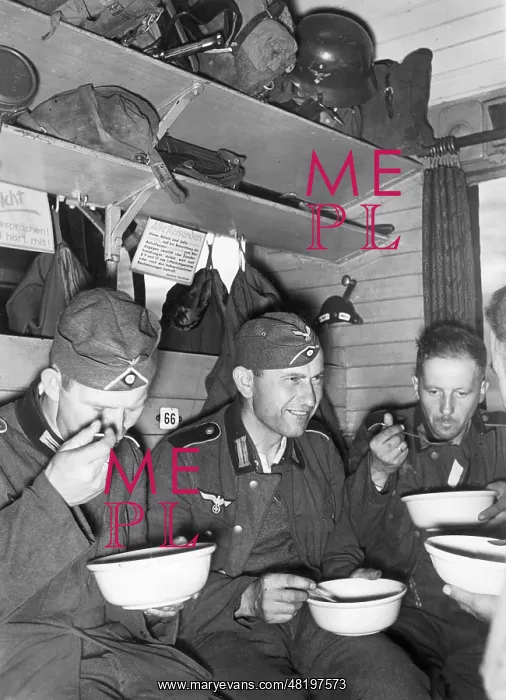 : German soldiers eat in the train compartment, 1941 : German soldiers eat in the train compartment, 1941