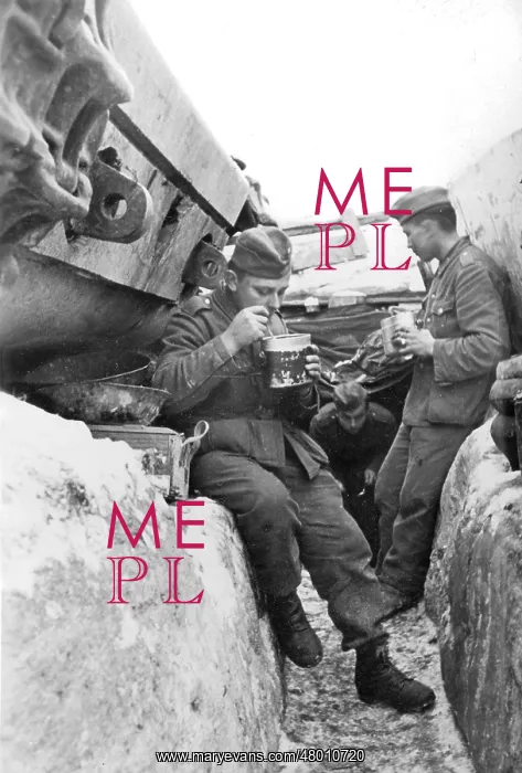 : German soldiers eating in the ditch : German soldiers eating in the ditch