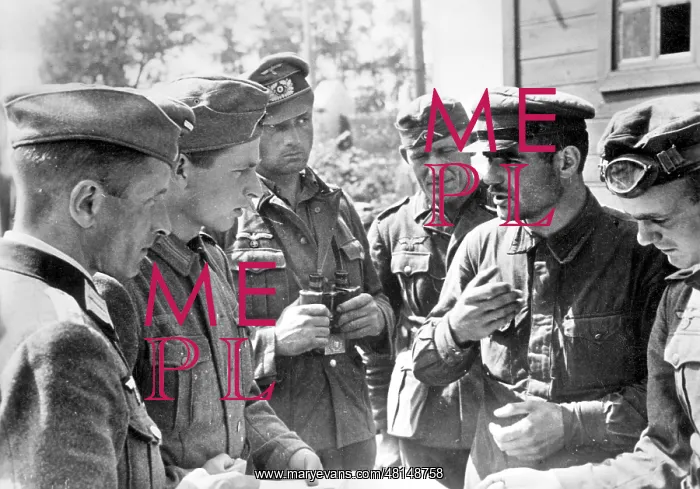 : German soldiers interrogate a political commissar, 1941 : German soldiers interrogate a political commissar, 1941