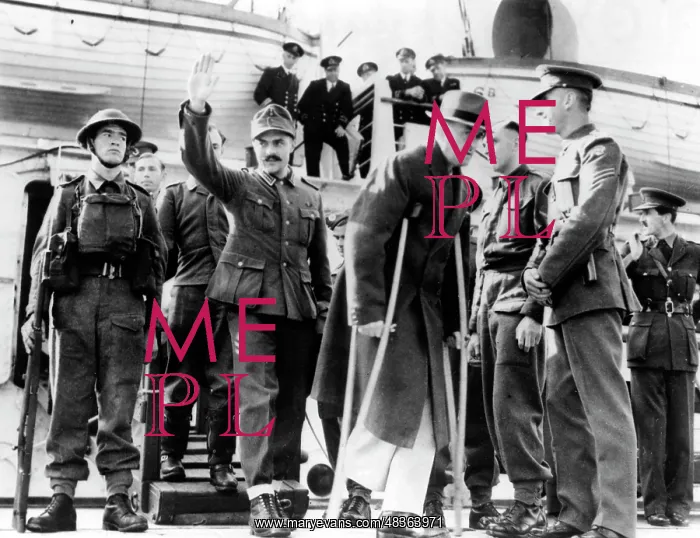 : German soldiers leave a British ship, 1941 : German soldiers leave a British ship, 1941