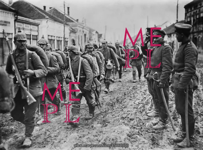 : German soldiers marching through the Serbian town : German soldiers marching through the Serbian town