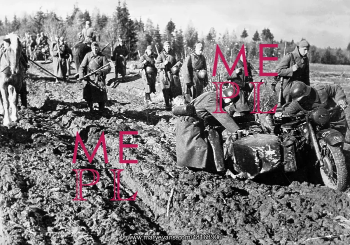 : German soldiers push a motorcycle with a sidecar which stran : German soldiers push a motorcycle with a sidecar which stran