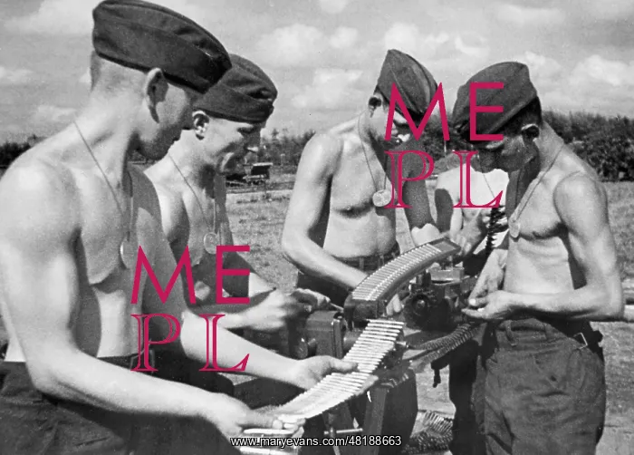 : German soldiers strap ammunition, 1941 : German soldiers strap ammunition, 1941
