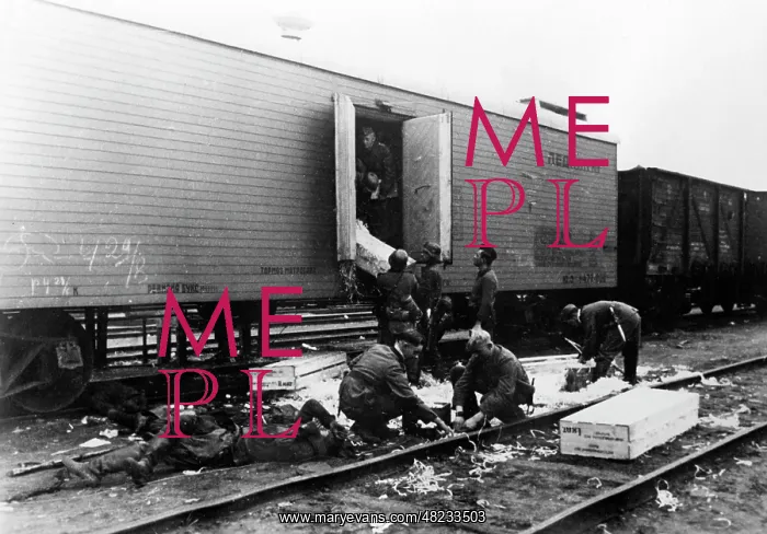 : German soldiers unload a conquered Soviet train on the : German soldiers unload a conquered Soviet train on the