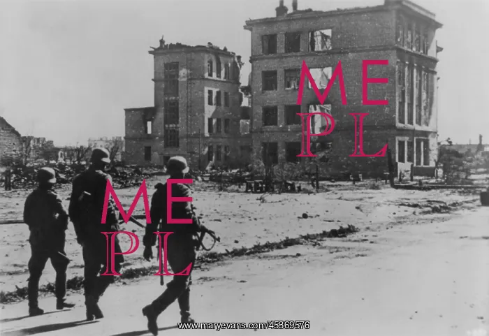 : Three German soldiers walking in desolate street : Three German soldiers walking in desolate street