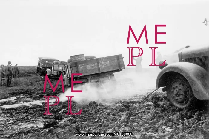 : German tractor pulls a truck out of the mud on the Eastern F : German tractor pulls a truck out of the mud on the Eastern F