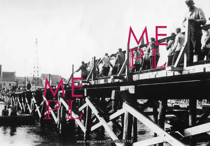 : German troops building a makeshift bridge, 1940 : German troops building a makeshift bridge, 1940