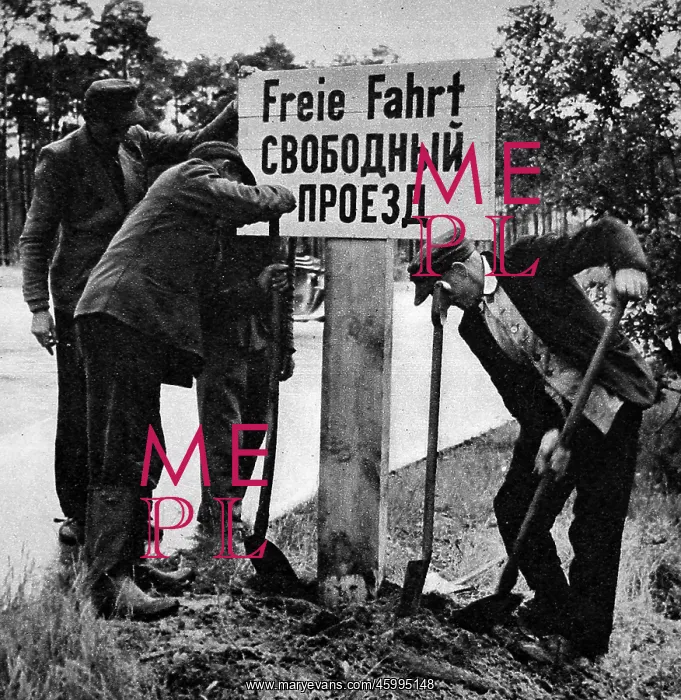: German Workers Re-erecting a Free Passage Sign, Berlin, 19 : German Workers Re-erecting a Free Passage Sign, Berlin, 19