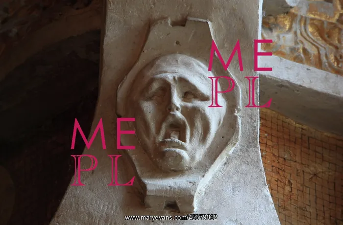: Ghostly head with expression of despair in carved : Ghostly head with expression of despair in carved