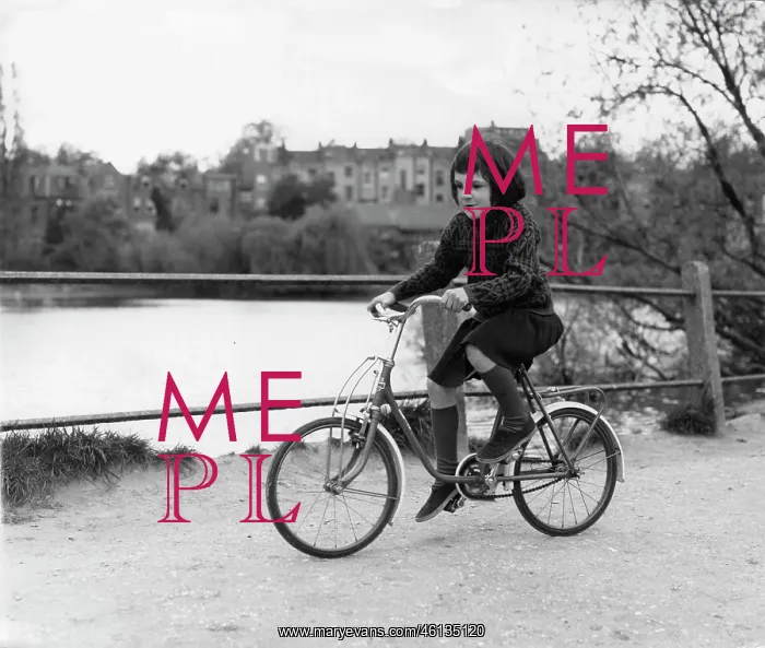 : Girl on a bicycle in a park : Girl on a bicycle in a park