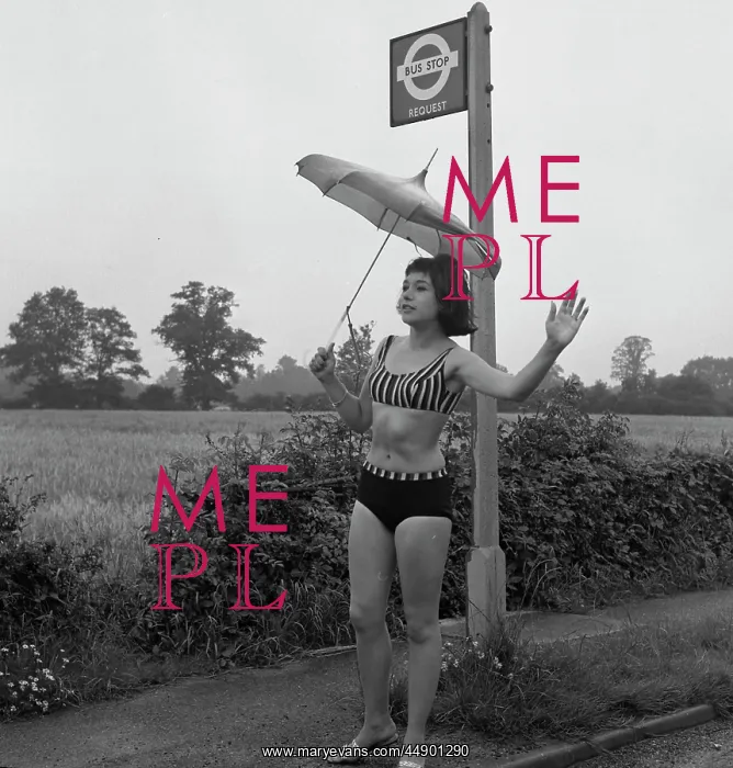 : Girl in a bikini at a bus stop : Girl in a bikini at a bus stop