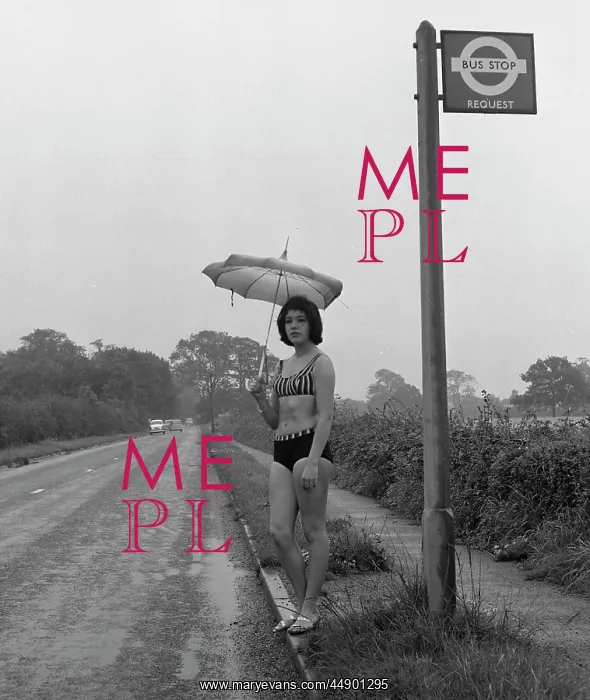 : Girl in a bikini at a bus stop : Girl in a bikini at a bus stop