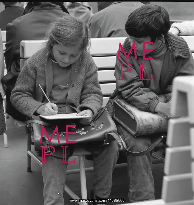 : Girl and boy with their school satchels : Girl and boy with their school satchels
