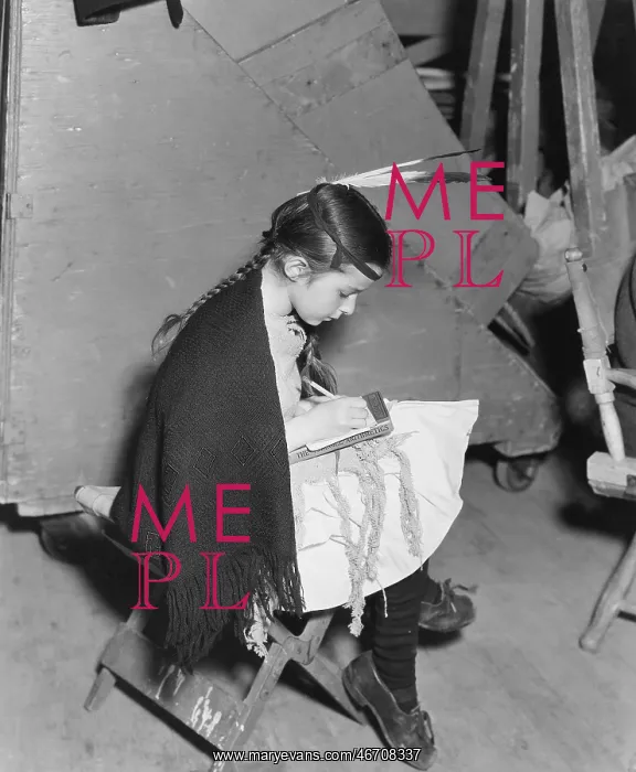 : Serious girl sitting and writing : Serious girl sitting and writing