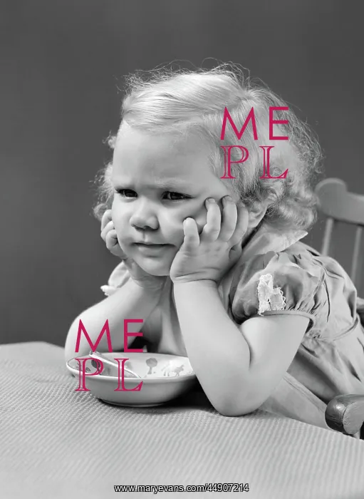 : Girl at table with head cradled in both hands : Girl at table with head cradled in both hands