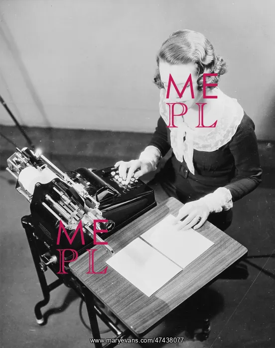 : Girl using adding machine : Girl using adding machine