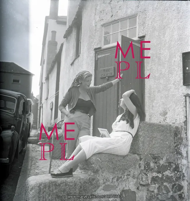: Girls chatting on the steps of The Cabin, St Ives, Cornwall : Girls chatting on the steps of The Cabin, St Ives, Cornwall
