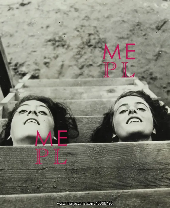 : Two girls putting their heads through : Two girls putting their heads through