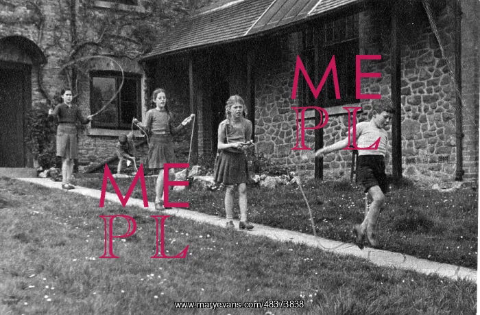  : Girls skipping down a path