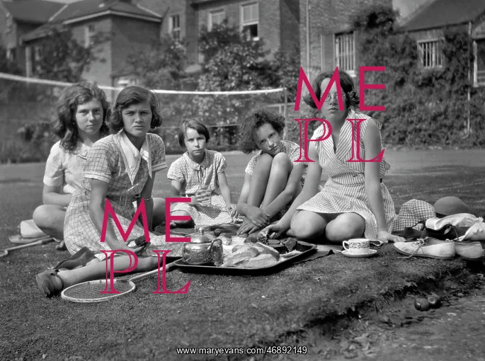 : Five girls with tea tray in a garden : Five girls with tea tray in a garden