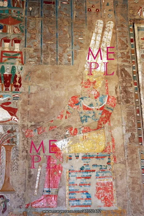 : The god Amon, sitting at a table of offerings. Temple of Hat : The god Amon, sitting at a table of offerings. Temple of Hat