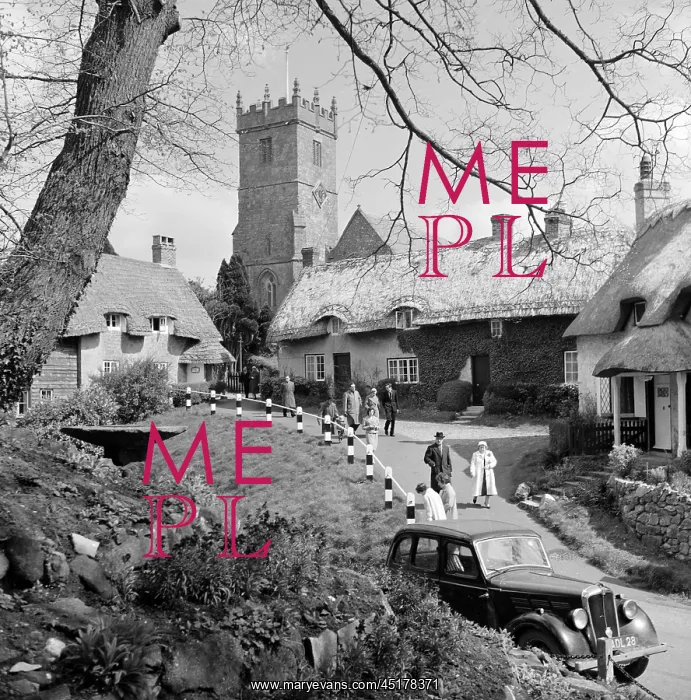 : Godshill. A car drives by on Church Hill below the three 18th century thatched cottages : Godshill. A car drives by on Church Hill below the three 18th century thatched cottages