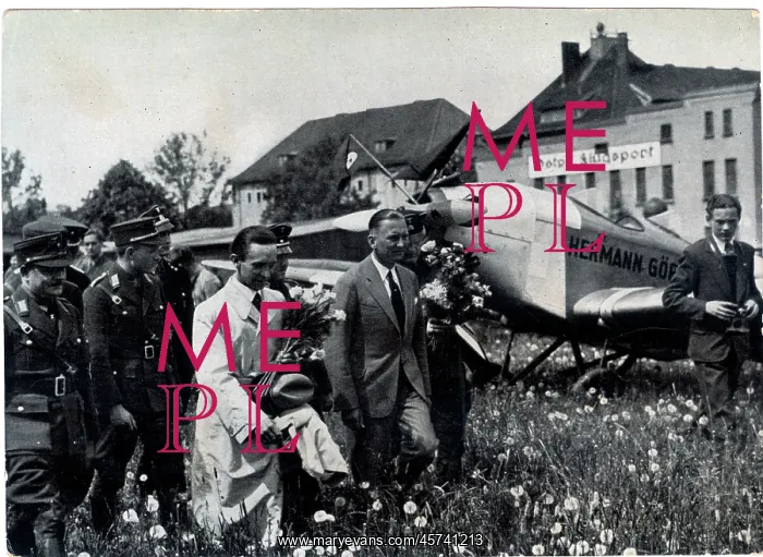 : Goebbels walking by a plane named Hermann Goering : Goebbels walking by a plane named Hermann Goering