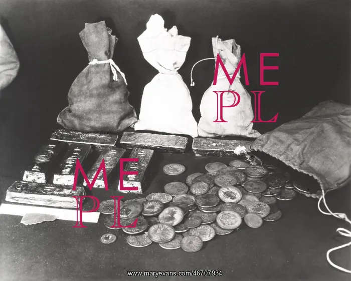  : Gold coins and bars laid out on table
