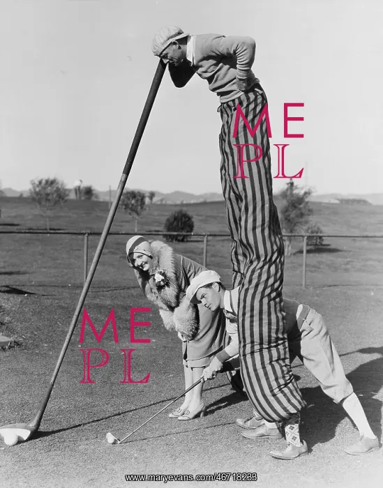  : Golf game with man on stilts