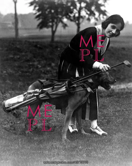 : Golfer and canine caddie