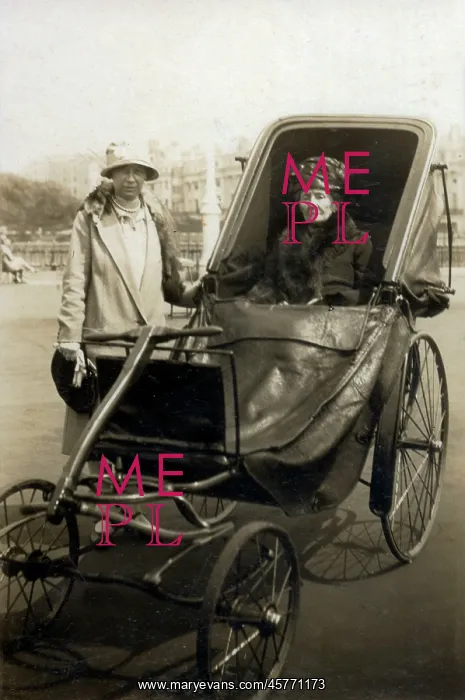 : Grand-looking elderly lady going out in her bath chair : Grand-looking elderly lady going out in her bath chair