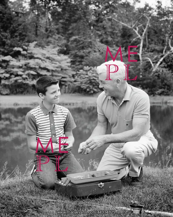 : Grandfather and Grandson Select Equipment from a Tackle Box : Grandfather and Grandson Select Equipment from a Tackle Box