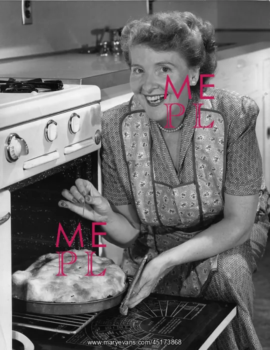 : Grandmom at stove baking a pie : Grandmom at stove baking a pie