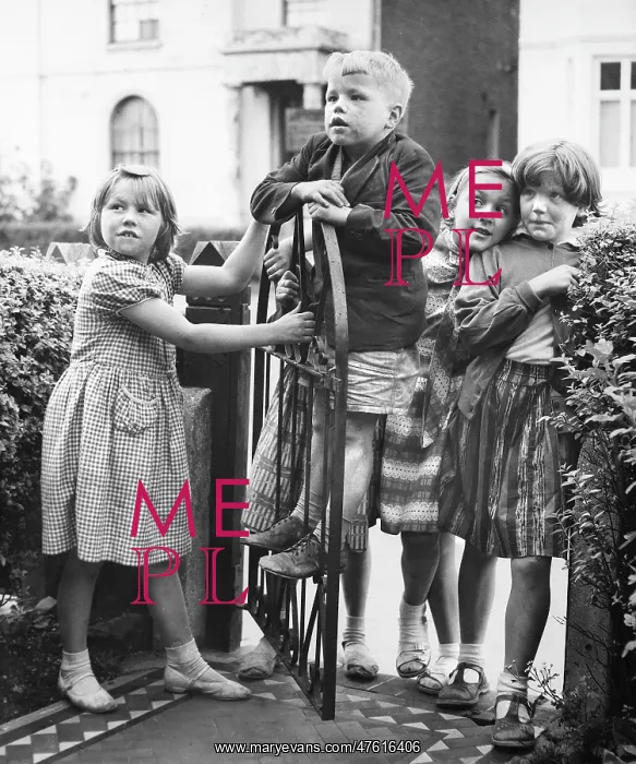 : Group of children at a gate, Balham, SW London : Group of children at a gate, Balham, SW London