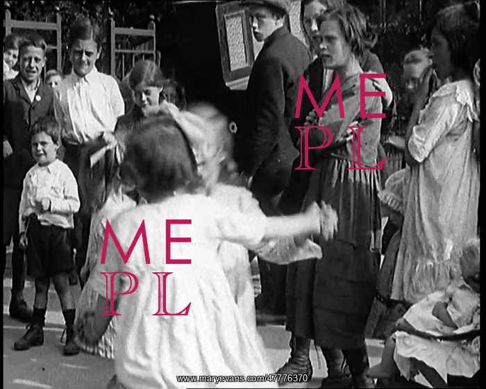 : A Group Of Civilian Children Dancing In Front : A Group Of Civilian Children Dancing In Front