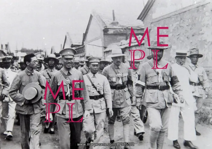 : Group of dignitaries walking along a street, Far East : Group of dignitaries walking along a street, Far East
