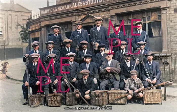 : Group of fishermen with baskets and rods outside a pub : Group of fishermen with baskets and rods outside a pub