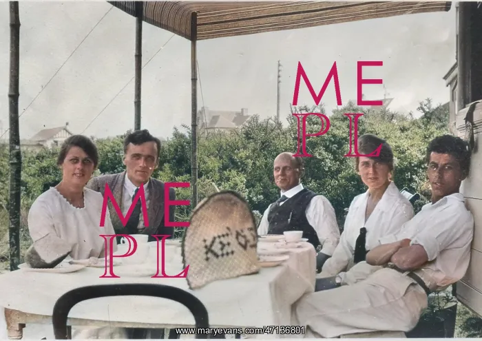 : Group of five holidaymakers at a table : Group of five holidaymakers at a table