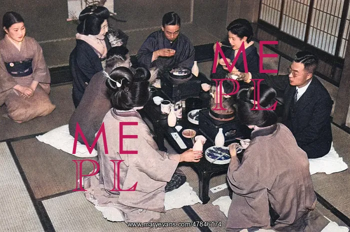 : A group of Japanese people eating a meal : A group of Japanese people eating a meal