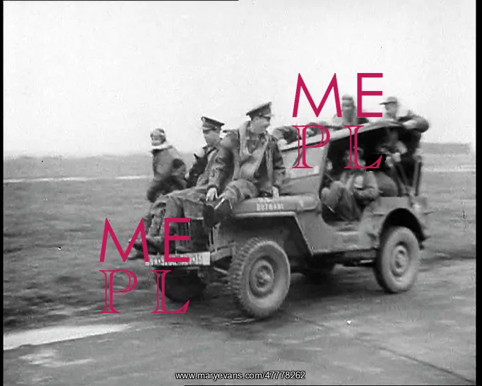 : A Group of Male Pilots Riding On Top of a Jeep : A Group of Male Pilots Riding On Top of a Jeep